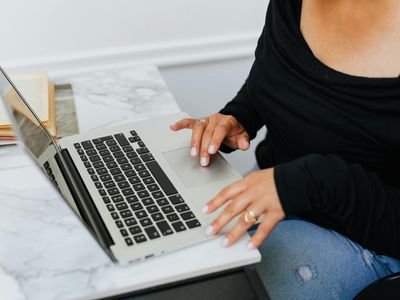 Person working at office laptop